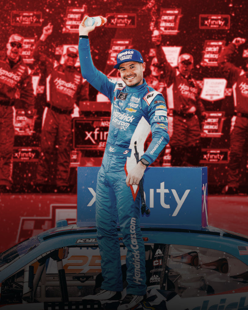 Kyle Larson celebrates a win in a K1 RaceGear suit