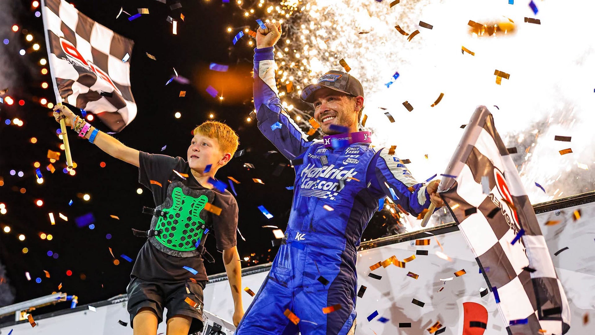 Kyle Larson waves checkerd flag after winning Knoxville Nationals 2026 