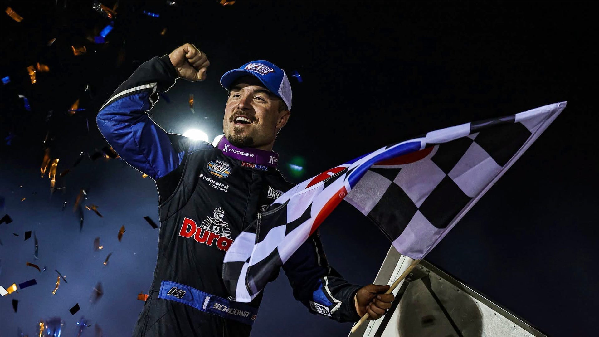 Schuchart waves the checkered flag after winning the World of Outlaws at Jackson Motorplex